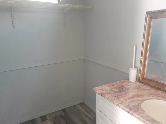 a bathroom with a sink and vanity