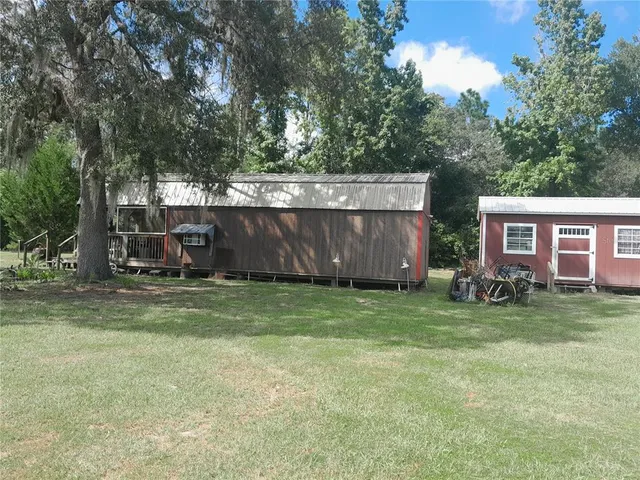 a view of backyard with green space