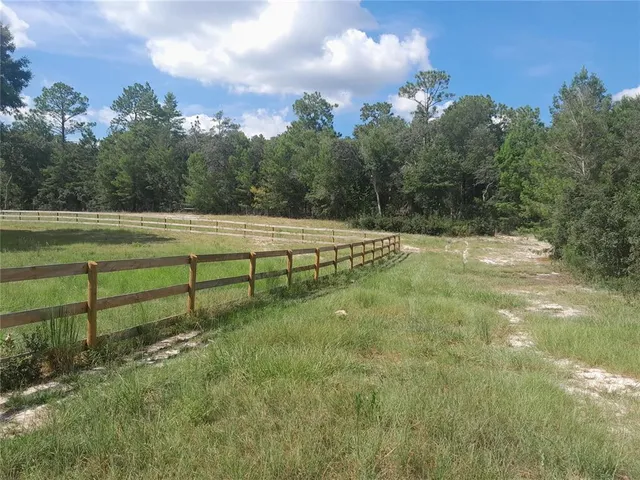 a view of a golf course with a lake
