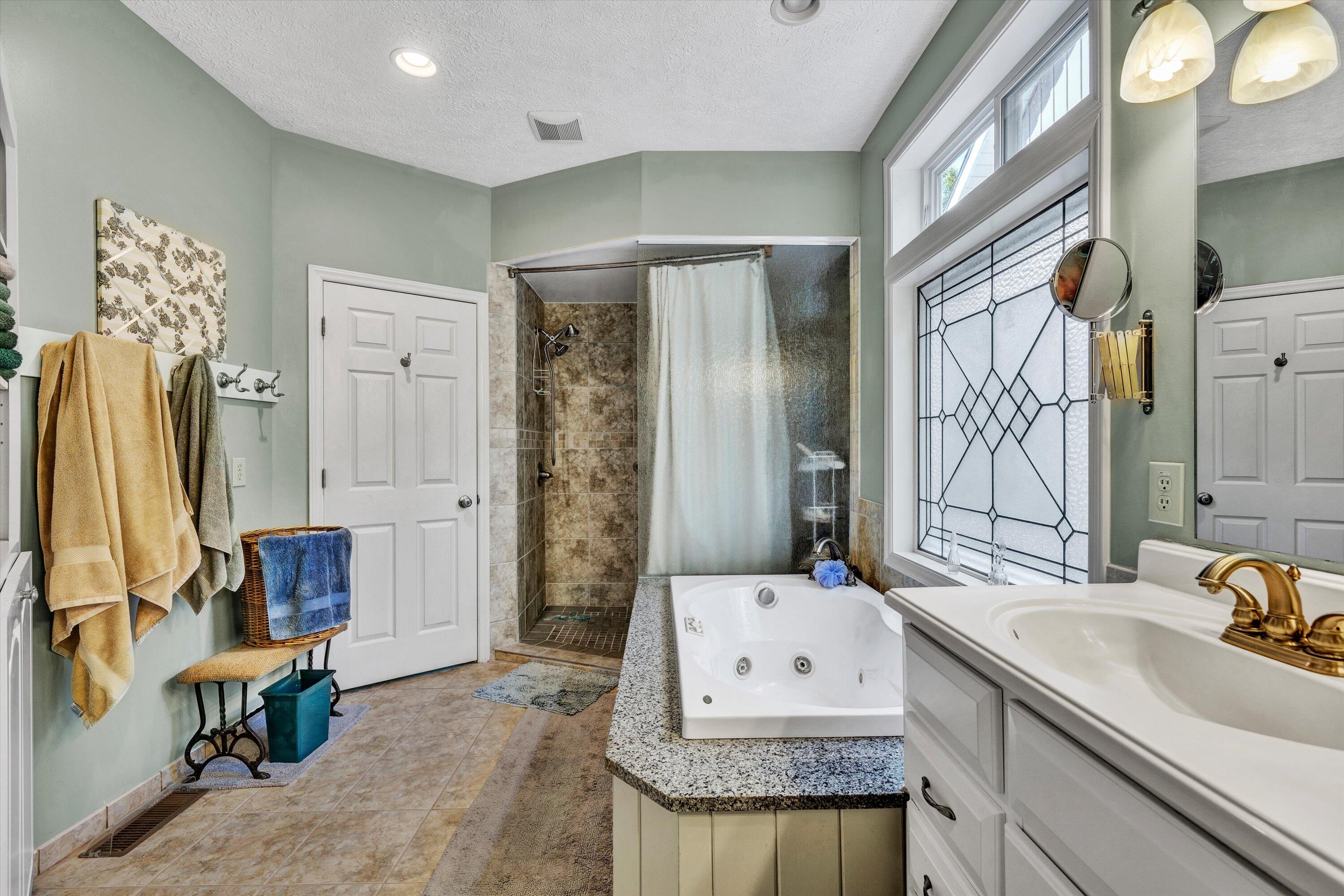 11289 Sontag Road Martinsville, VA 24112 - Photo 32 of 55 a bathroom with a granite countertop sink and a mirror