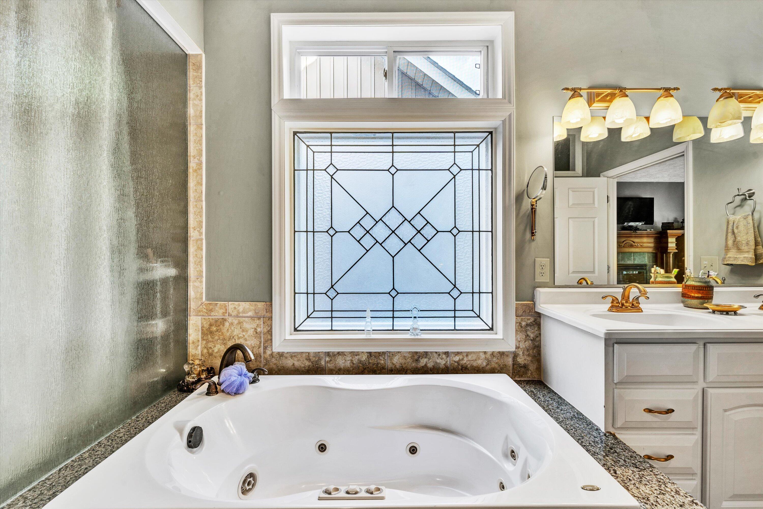 11289 Sontag Road Martinsville, VA 24112 - Photo 33 of 55 a bathroom with a bathtub a sink and a window