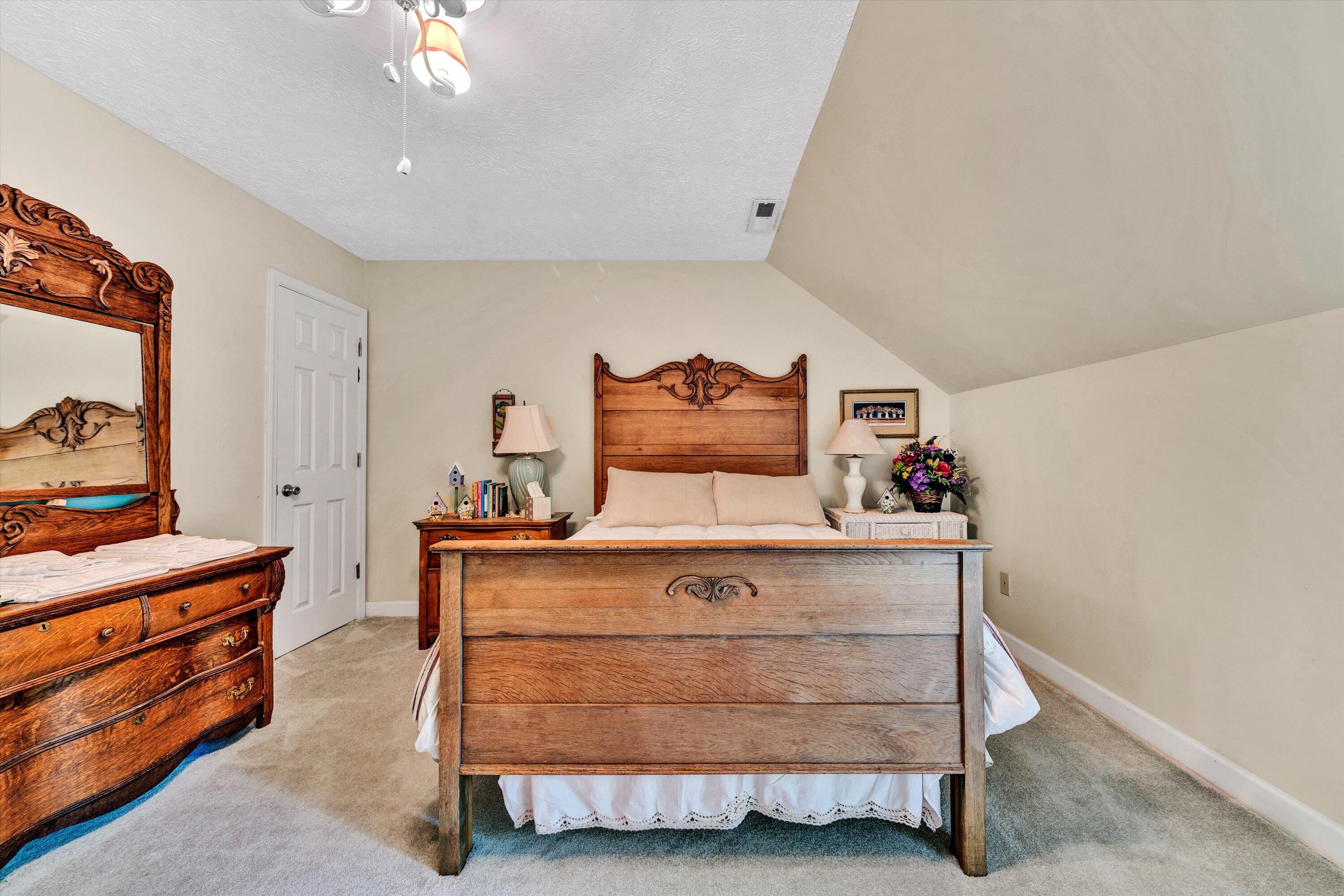 11289 Sontag Road Martinsville, VA 24112 - Photo 41 of 55 a bed room with a bed and a dresser