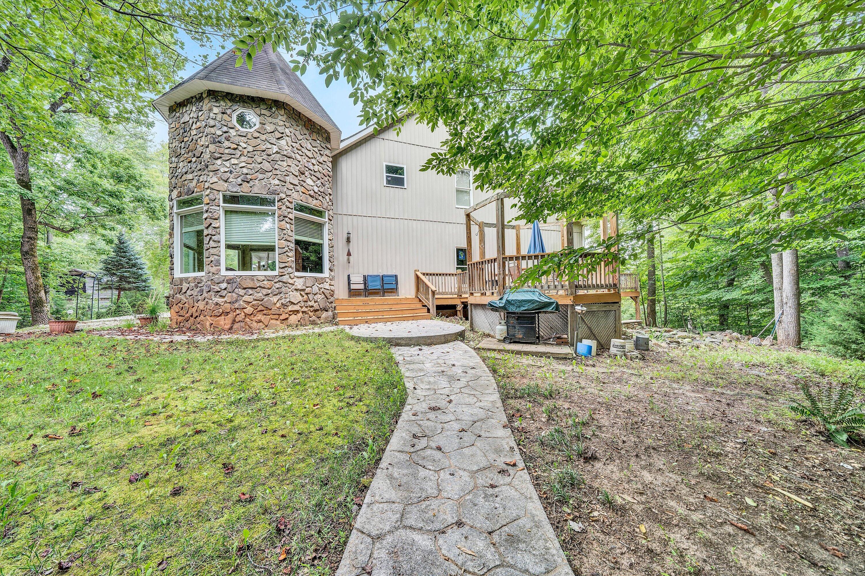 11289 Sontag Road Martinsville, VA 24112 - Photo 53 of 55 a view of a patio with table and chairs a barbeque with wooden fence