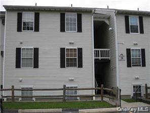 Rear view of property featuring a balcony