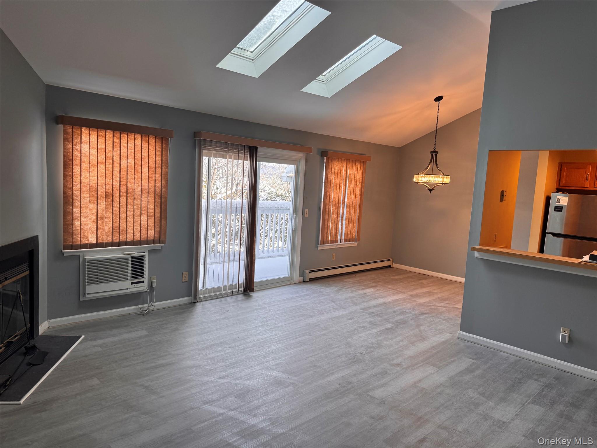 4 Lexington Hills Road, Unit 6 Harriman, NY 10926 - Photo 4 of 19 wooden floor in an empty room with a window
