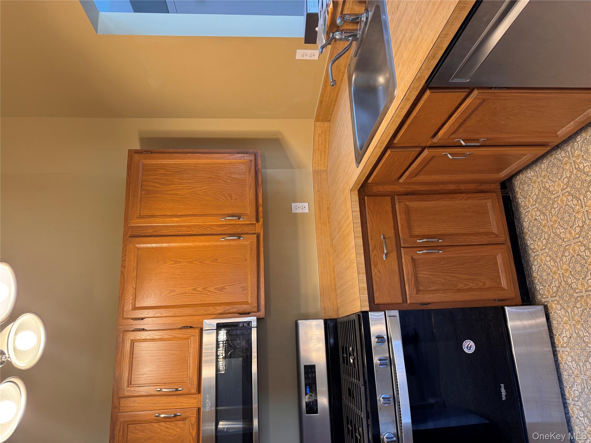 4 Lexington Hills Road, Unit 6 Harriman, NY 10926 - Photo 10 of 19 a kitchen with a sink stove and cabinets