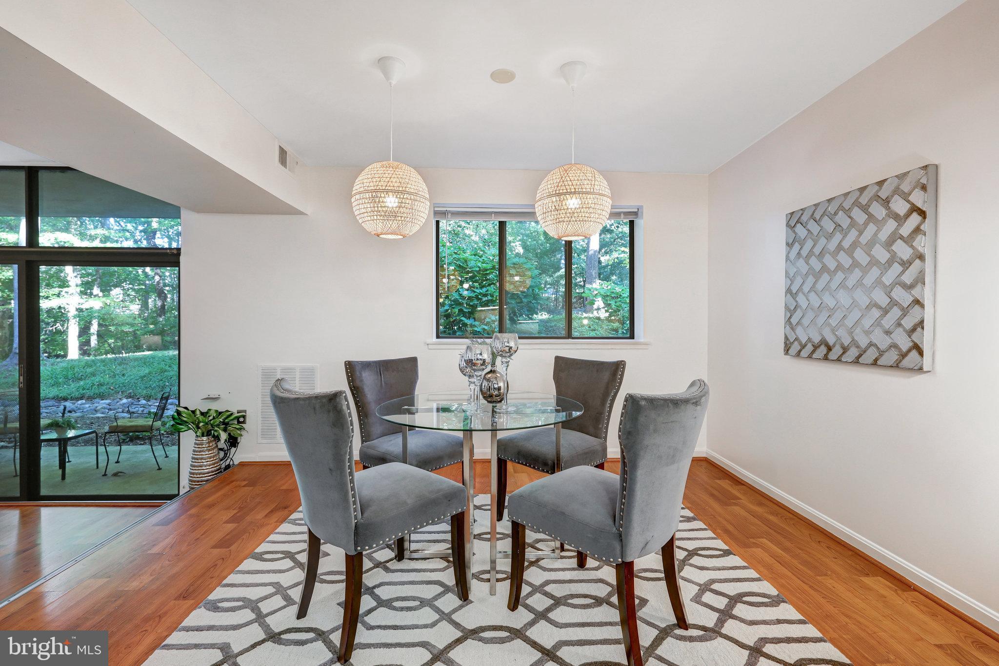 1650 Parkcrest Circle, Unit 101 Reston, VA 20190 - Photo 11 of 40 Dining room faces woods and opens to kitchen + LR