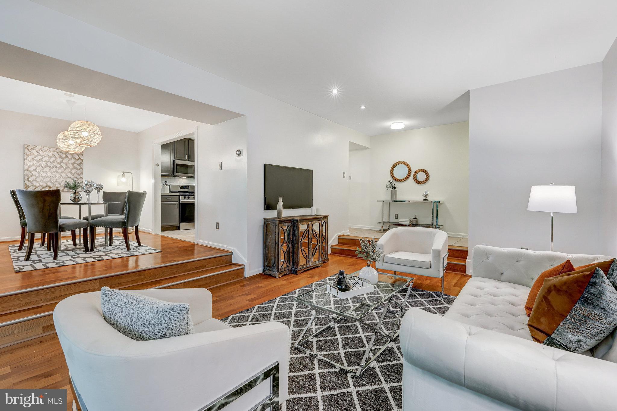 1650 Parkcrest Circle, Unit 101 Reston, VA 20190 - Photo 4 of 40 Open living room/dining room