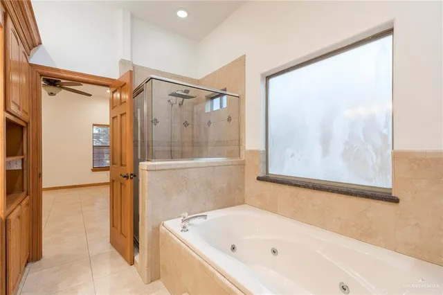 a bathroom with a bathtub and a shower