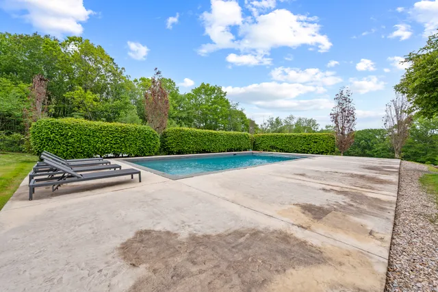 a view of a street with a yard