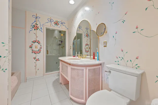 a spacious bedroom with a bed and a couch