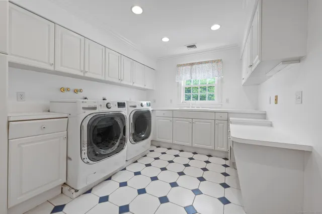 a bathroom with a sink a mirror and a toilet