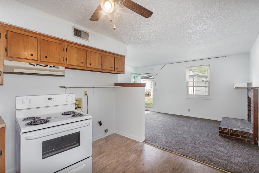 4357 Central Valley Drive Hermitage, TN 37076 - Photo 12 of 19 a kitchen with stainless steel appliances granite countertop a stove and a refrigerator