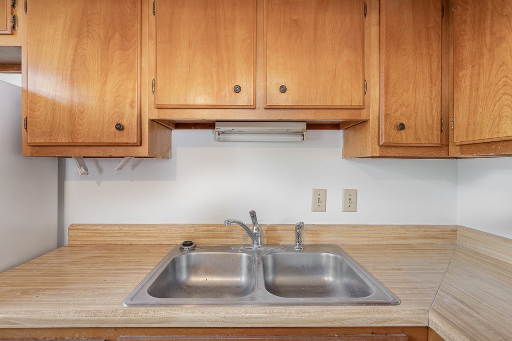 4357 Central Valley Drive Hermitage, TN 37076 - Photo 13 of 19 a kitchen with granite countertop white cabinets and a sink