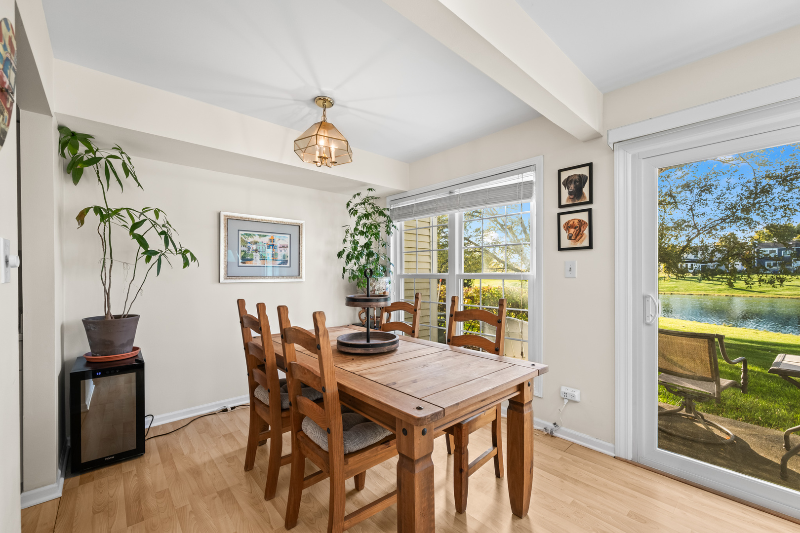 1376 Longacre Lane Wheeling, IL 60090 - Photo 6 of 16 a view of a dining room with furniture a chandelier and wooden floor