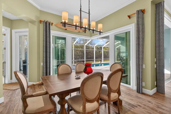 a view of a dining room with furniture window and outside view