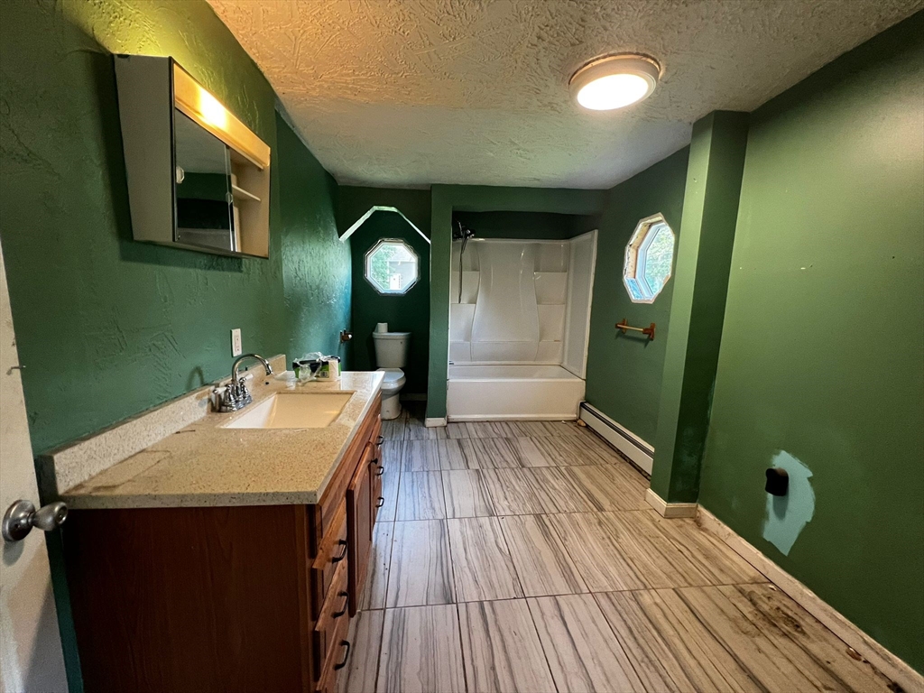 16 Grist Mill Road Grafton, MA 01519 - Photo 13 of 16 a bathroom with a sink and a mirror
