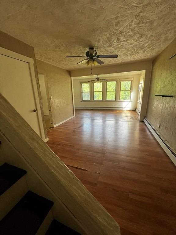 16 Grist Mill Road Grafton, MA 01519 - Photo 5 of 16 a view of empty room with wooden floor and fan