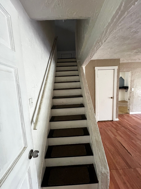 16 Grist Mill Road Grafton, MA 01519 - Photo 6 of 16 a view of entryway with wooden floor and stairs