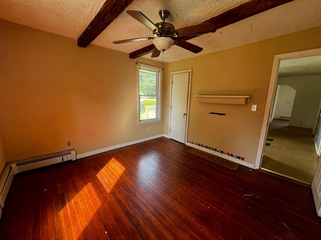 16 Grist Mill Road Grafton, MA 01519 - Photo 8 of 16 a view of empty room with wooden floor and fan