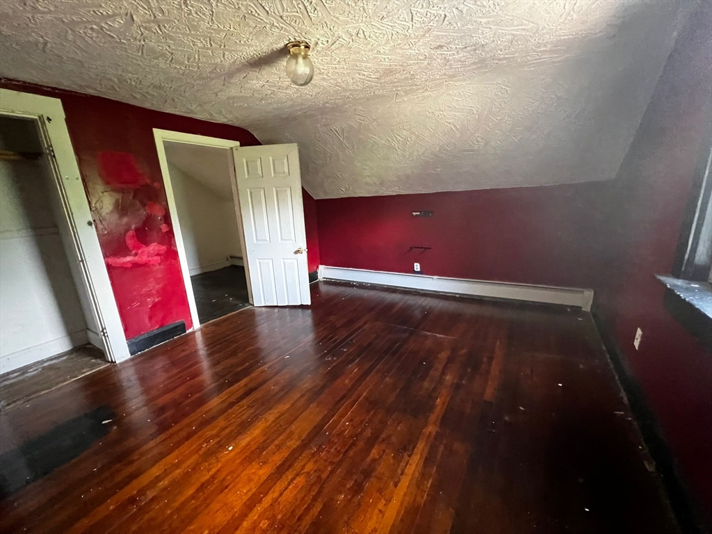 16 Grist Mill Road Grafton, MA 01519 - Photo 9 of 16 a view of an empty room with wooden floor