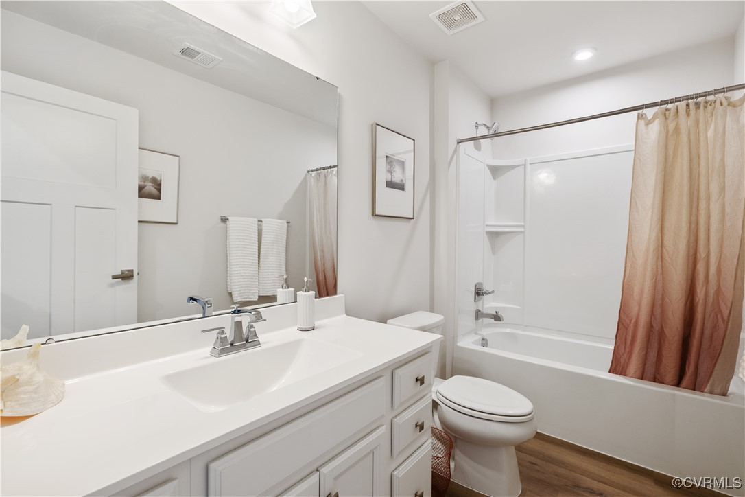 13901 Marsham Road Chester, VA 23836 - Photo 17 of 27 a bathroom with a sink toilet and shower