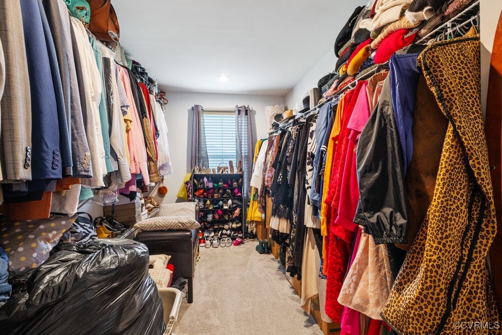 13901 Marsham Road Chester, VA 23836 - Photo 21 of 27 a view of walk in closet with clothes and shoes