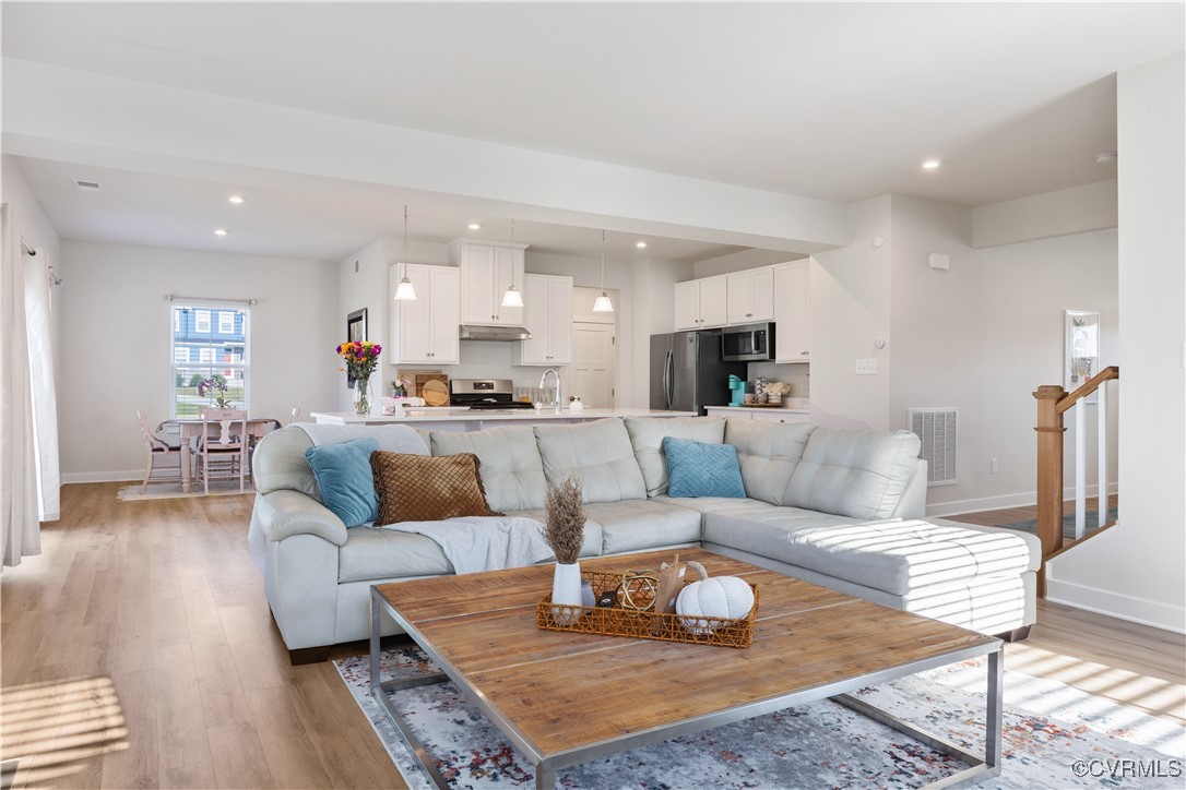 13901 Marsham Road Chester, VA 23836 - Photo 7 of 27 a living room with furniture and a wooden floor
