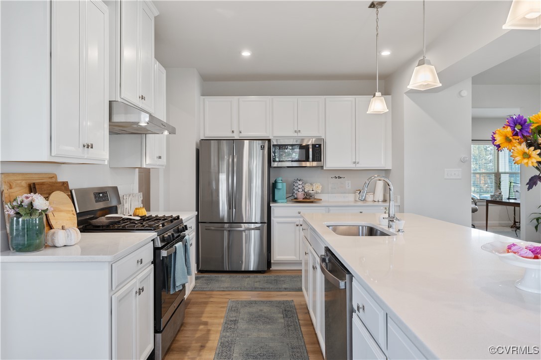 13901 Marsham Road Chester, VA 23836 - Photo 9 of 27 a kitchen that has a sink stainless steel appliances a refrigerator and a stove