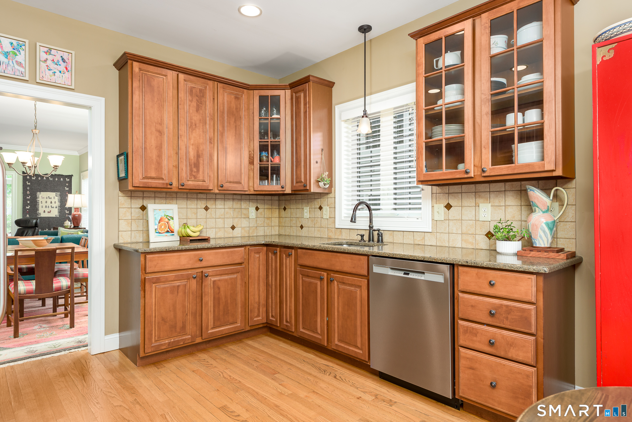 8 Greendale Drive, Unit 8 Suffield, CT 06078 - Photo 23 of 40 a kitchen with stainless steel appliances granite countertop a sink and cabinets
