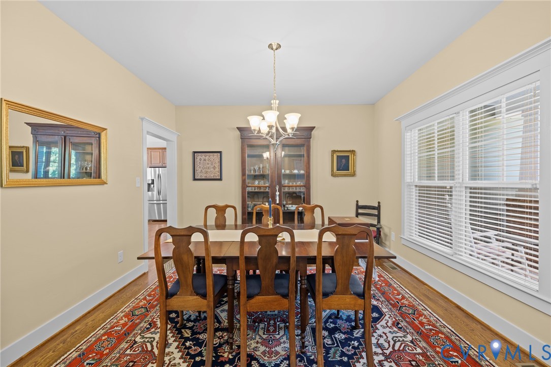 705 Wales Way Ashland, VA 23005 - Photo 21 of 62 a view of a dining room with furniture and chandelier