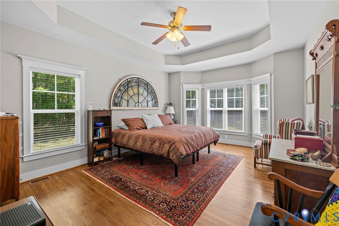 705 Wales Way Ashland, VA 23005 - Photo 23 of 62 a spacious bedroom with a bed a dresser and a large window