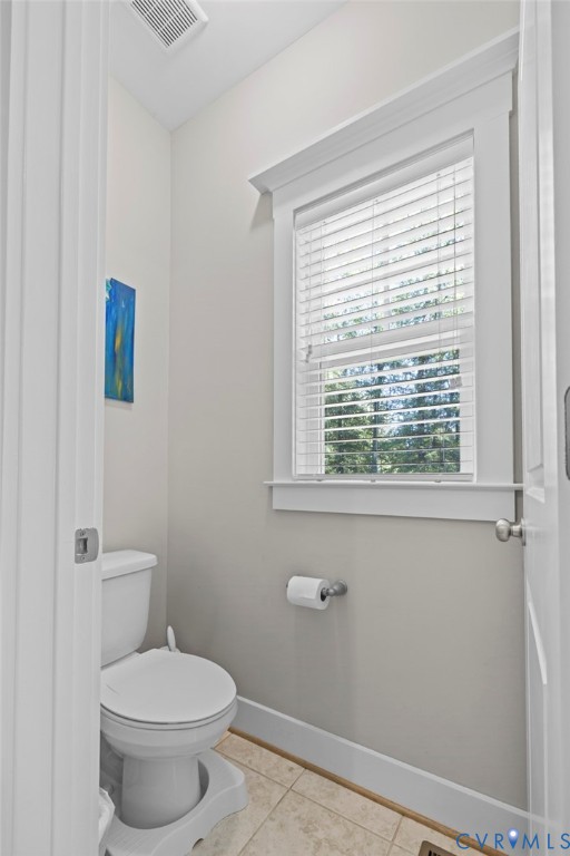705 Wales Way Ashland, VA 23005 - Photo 29 of 62 a white toilet sitting next to a window in a bathroom