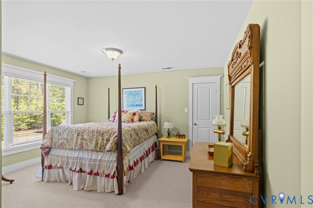 705 Wales Way Ashland, VA 23005 - Photo 32 of 62 a bedroom with a bed and a dresser