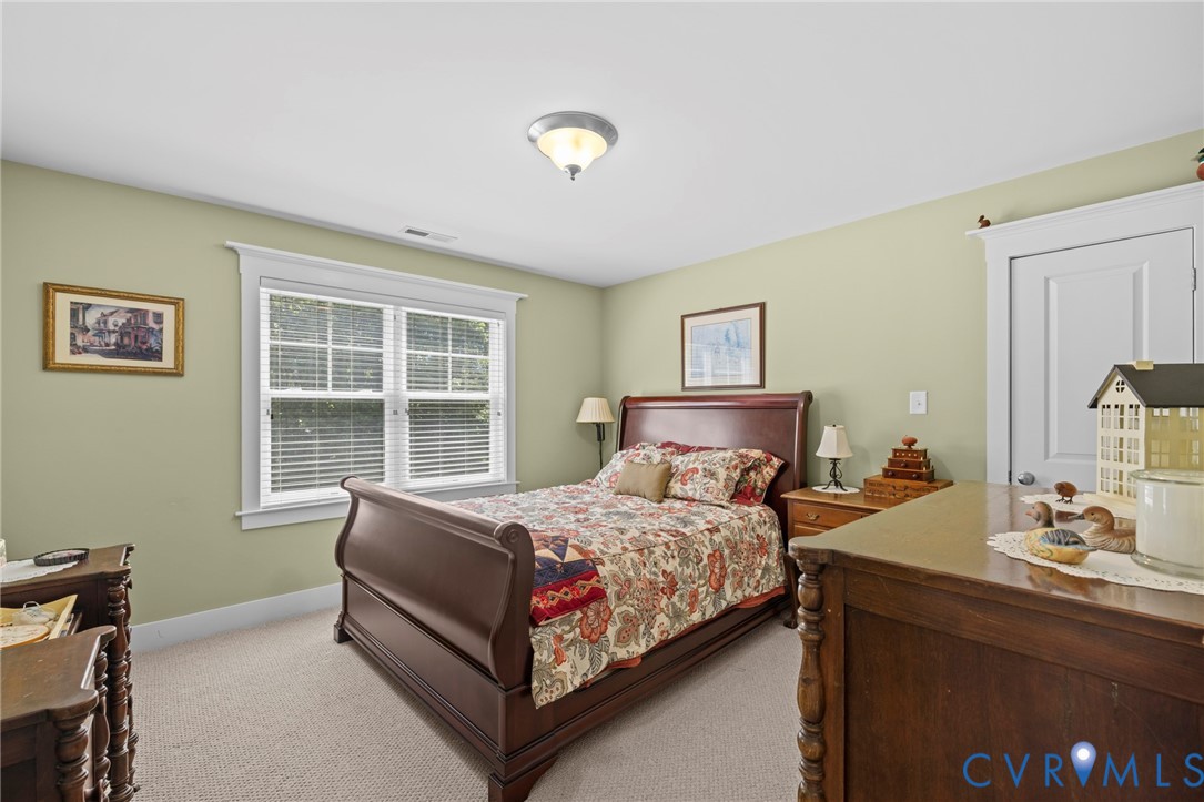 705 Wales Way Ashland, VA 23005 - Photo 36 of 62 a bedroom with a bed and a window