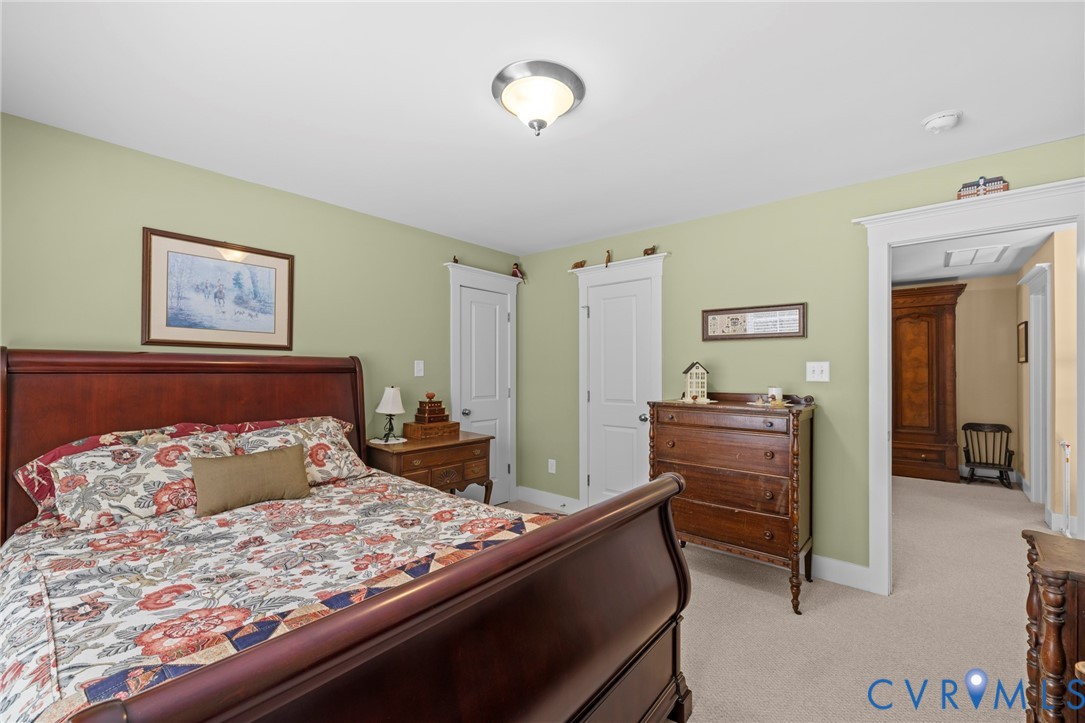 705 Wales Way Ashland, VA 23005 - Photo 37 of 62 a bedroom with a bed and a dresser