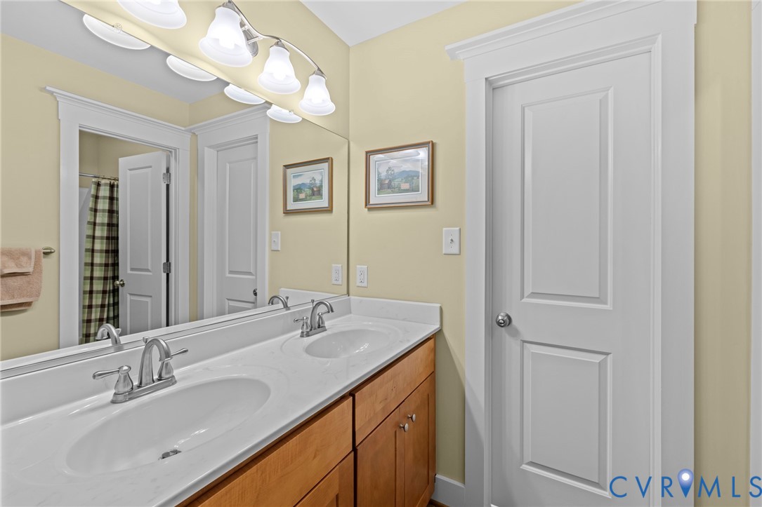 705 Wales Way Ashland, VA 23005 - Photo 38 of 62 a bathroom with a sink vanity and a mirror
