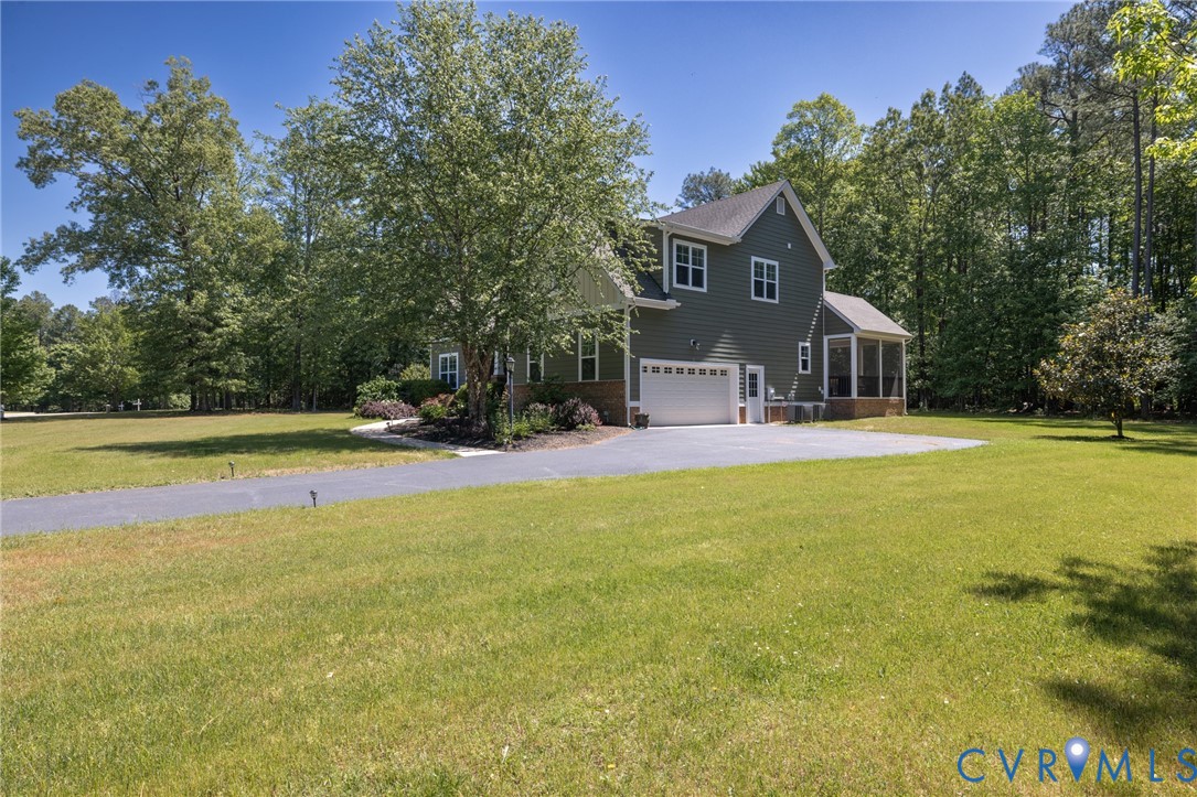 705 Wales Way Ashland, VA 23005 - Photo 5 of 62 a view of swimming pool with large trees and wooden fence