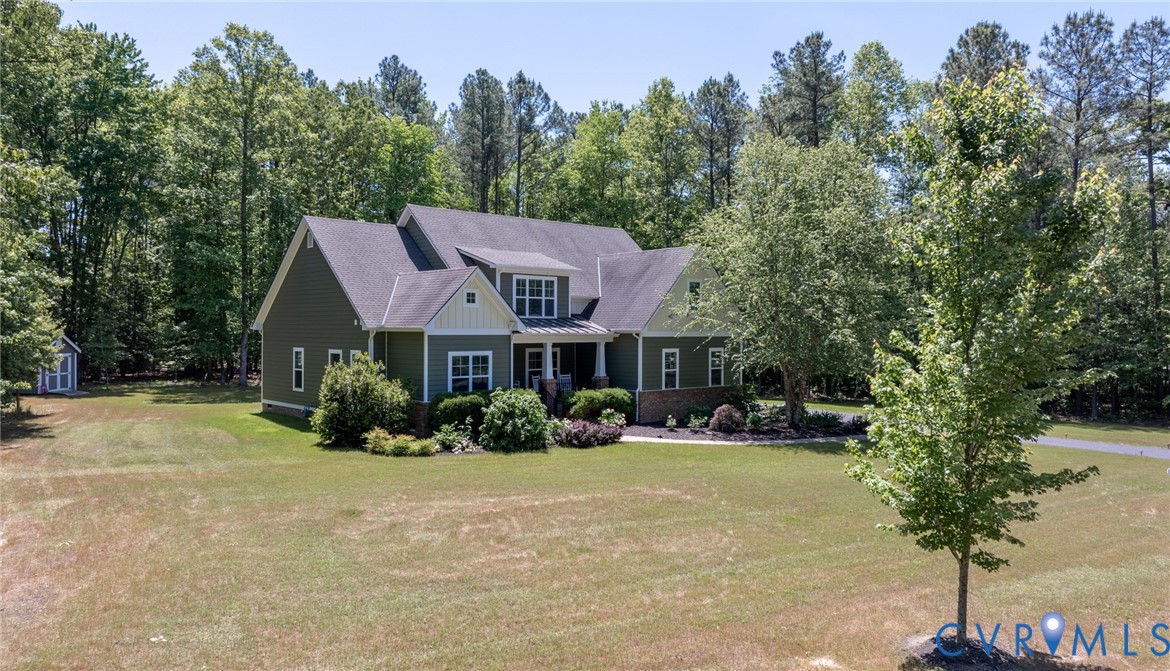 705 Wales Way Ashland, VA 23005 - Photo 60 of 62 a front view of a house with a yard and trees