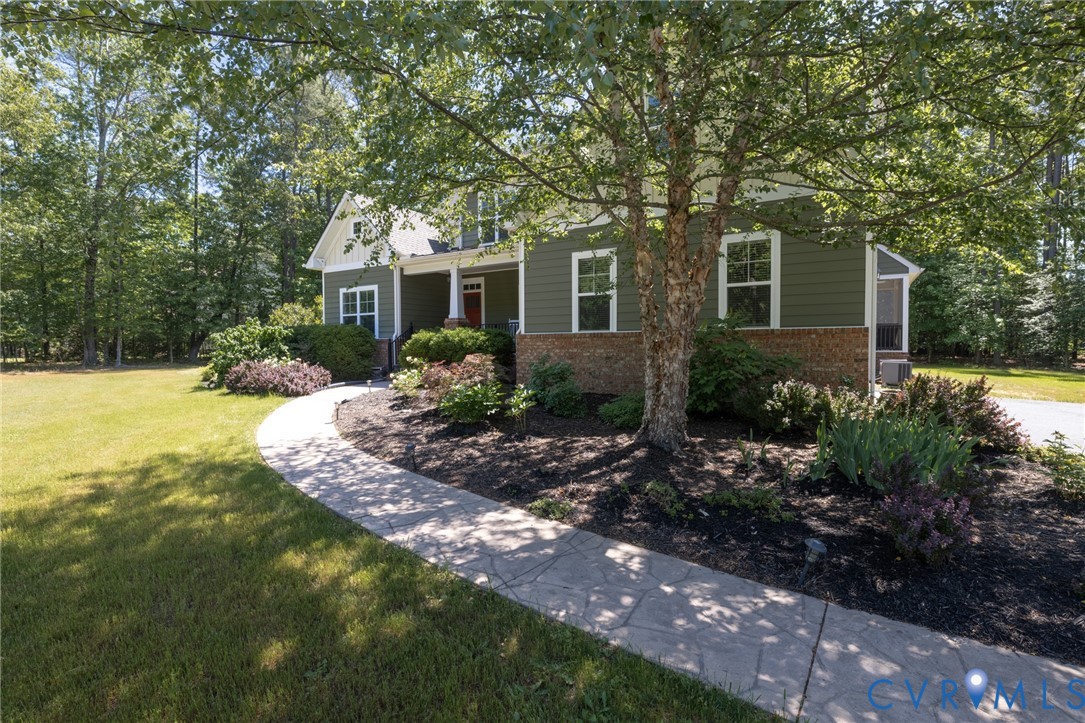 705 Wales Way Ashland, VA 23005 - Photo 6 of 62 a front view of a house with garden