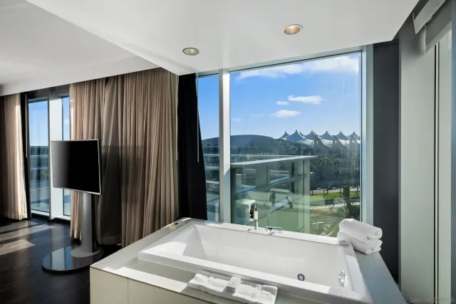 a en suite bathroom with a sink double vanity and shower