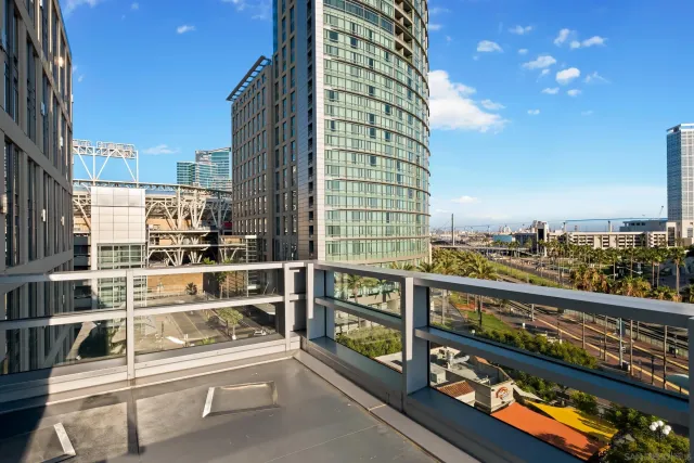 a bedroom with a large bed and a couch