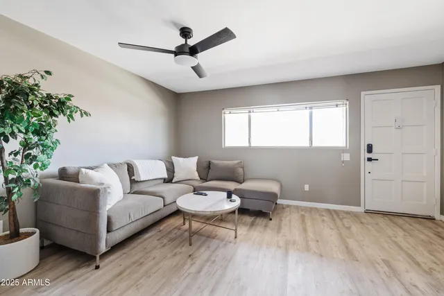 a living room with furniture and a window