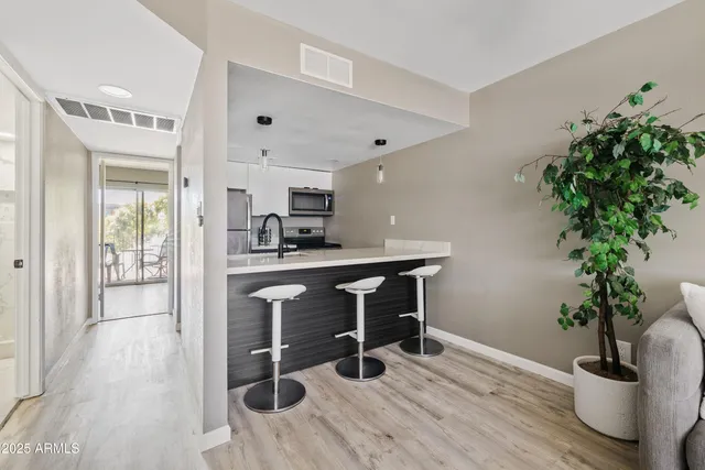 a view of kitchen with furniture and wooden floor