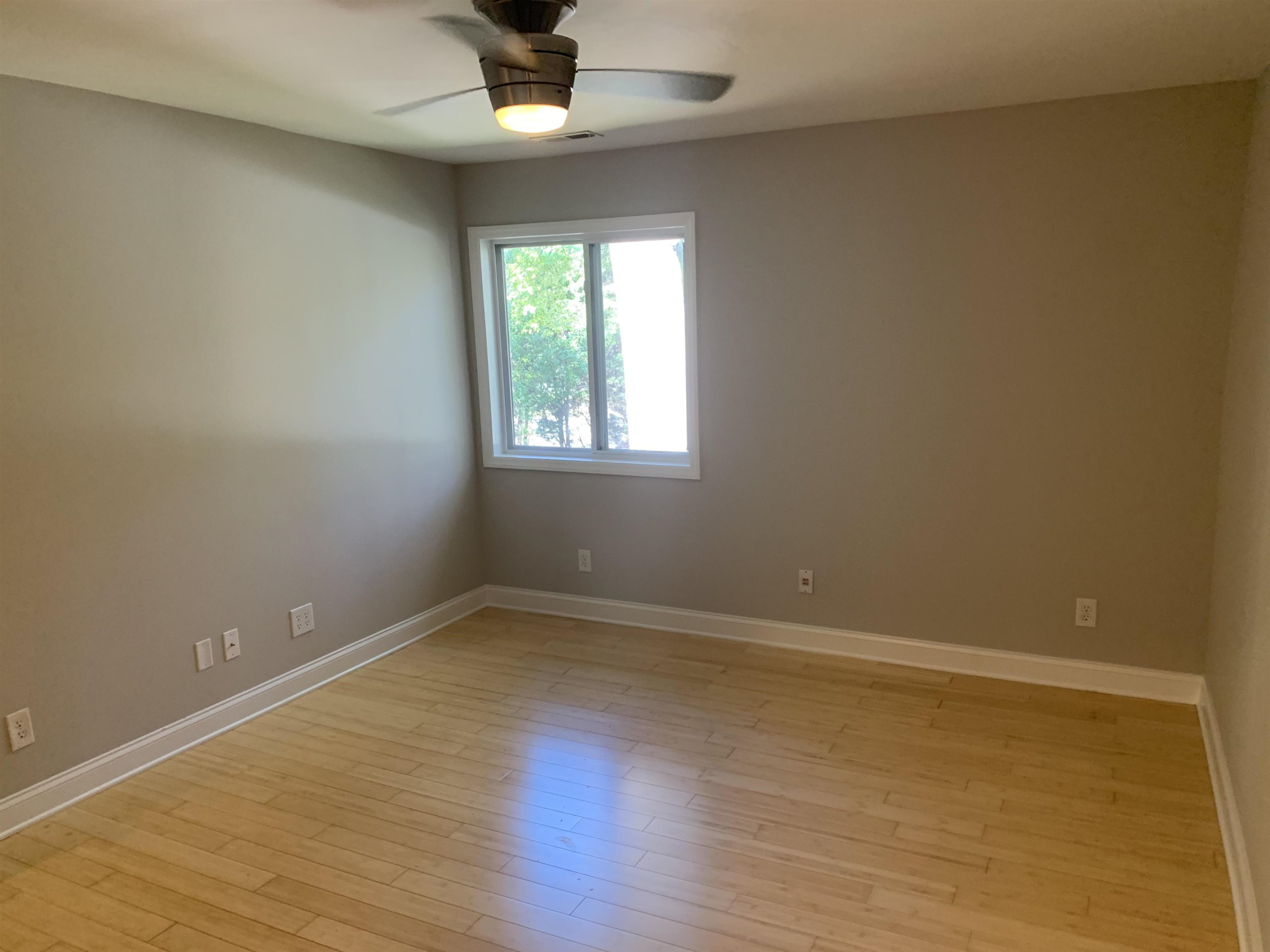 4505 Edwards Mill Road, Unit E Raleigh, NC 27612 - Photo 7 of 14 an empty room with a empty space and window