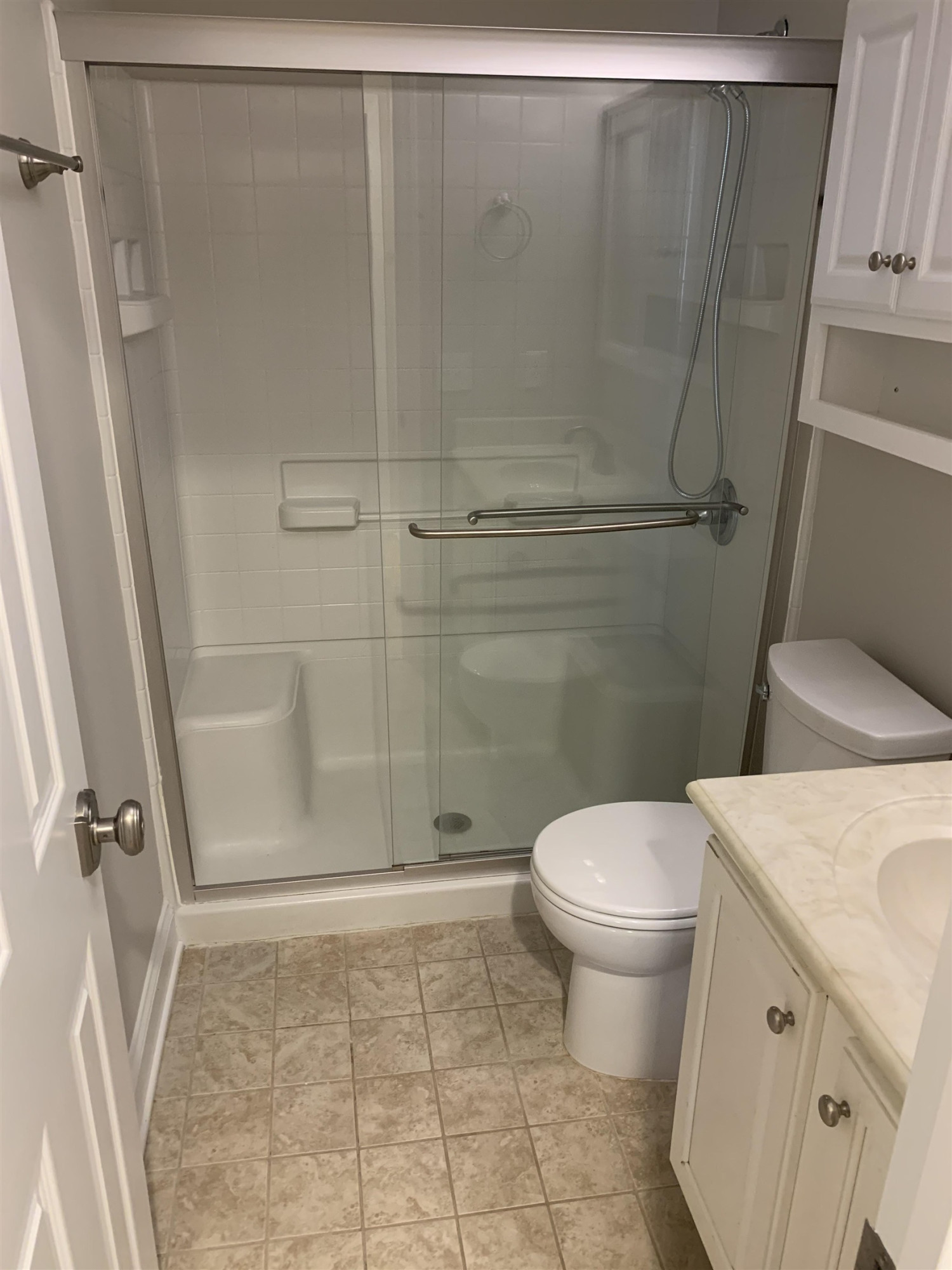 4505 Edwards Mill Road, Unit E Raleigh, NC 27612 - Photo 8 of 14 a bathroom with a sink and a toilet
