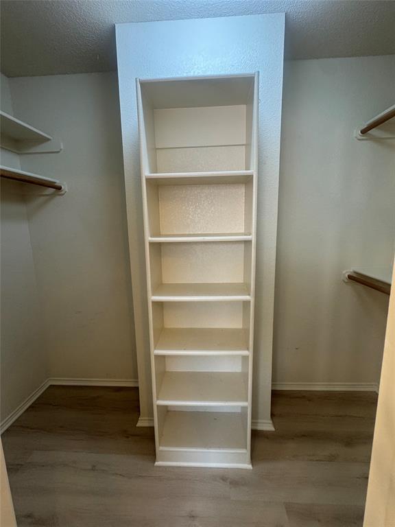 908 Cedar Ridge Lane Burleson, TX 76028 - Photo 15 of 24 a view of walk in closet with empty racks