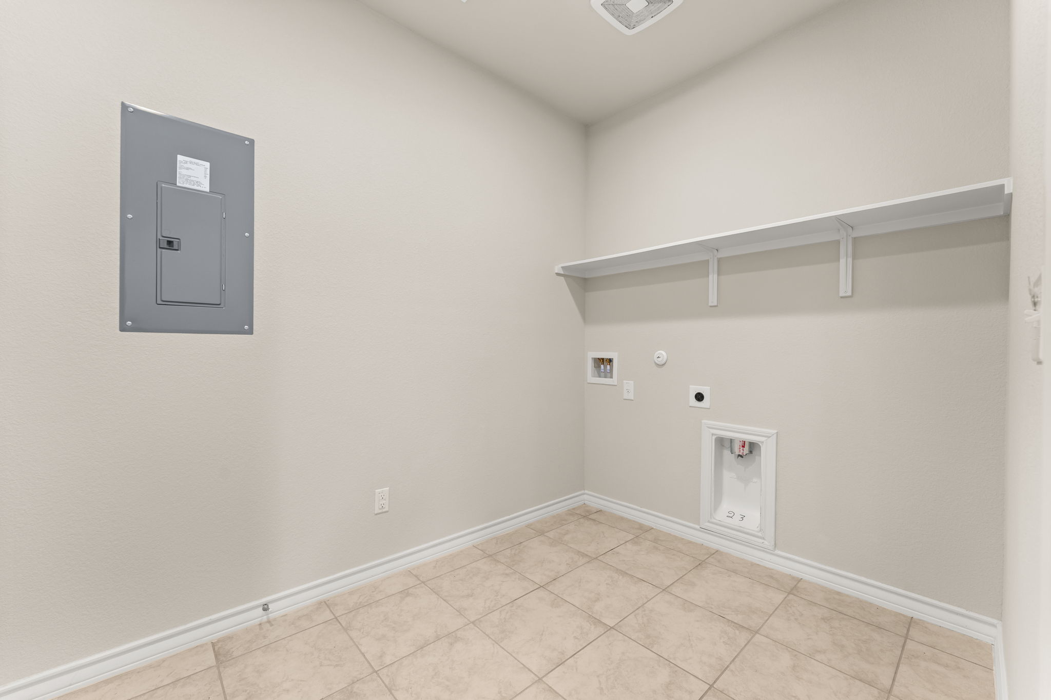 740 Aliso Trail Leander, TX 78641 - Photo 21 of 35 The main-floor laundry room provides a functional setup with ample space for organization, storage, and everyday household tasks.