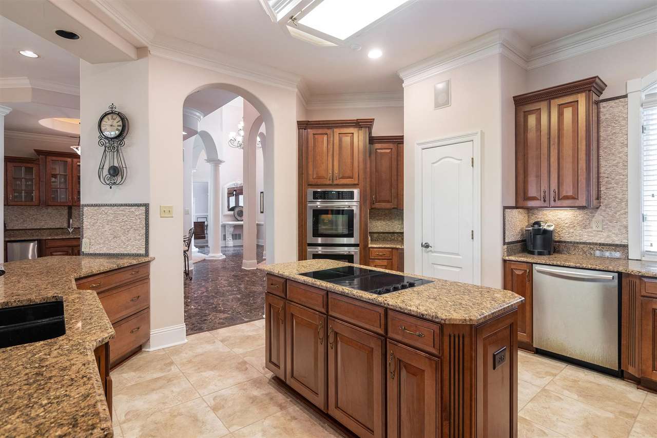 9496 Mayfield Road South Collierville, TN 38017 - Photo 13 of 25 a kitchen with stainless steel appliances granite countertop a stove and a sink