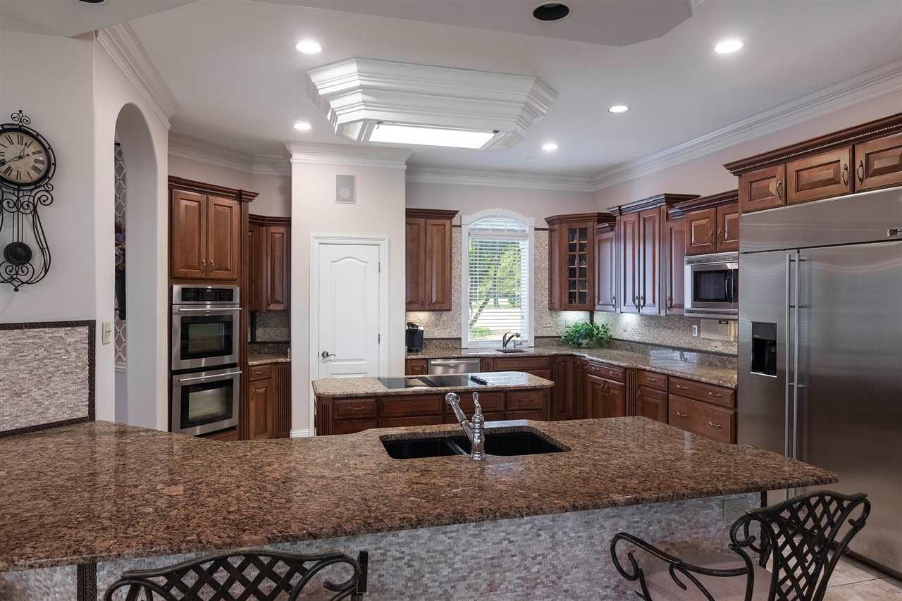 9496 Mayfield Road South Collierville, TN 38017 - Photo 15 of 25 a kitchen with refrigerator and cabinets